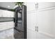 Modern kitchen with stainless steel refrigerator and bright white cabinets at 648 Shakespeare Dr, Avon, IN 46123