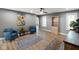 Open living room with neutral gray walls and hardwood floors at 648 Shakespeare Dr, Avon, IN 46123