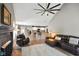 Inviting living room features an open layout, fireplace, and bar seating at the kitchen counter at 648 Shakespeare Dr, Avon, IN 46123