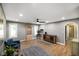 Bright living room featuring hardwood floors, a ceiling fan, and neutral gray walls at 648 Shakespeare Dr, Avon, IN 46123