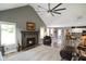Spacious living room boasts a cozy fireplace, plush rug, and views to the kitchen at 648 Shakespeare Dr, Avon, IN 46123