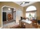 Well-lit office showcases a functional desk setup, shelving, and front entry access at 648 Shakespeare Dr, Avon, IN 46123