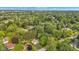 An aerial view displays the property set among mature trees in this neighborhood at 703 Chapel Hill W Dr, Indianapolis, IN 46214