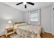 Inviting bedroom with hardwood floors, closet, and natural light at 703 Chapel Hill W Dr, Indianapolis, IN 46214