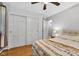Bedroom featuring hardwood floors, a large closet, and soft, natural light at 703 Chapel Hill W Dr, Indianapolis, IN 46214