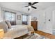 Bright bedroom featuring natural light, hardwood floors, and neutral decor at 703 Chapel Hill W Dr, Indianapolis, IN 46214