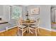 Cozy dining area features a wood table with seating for four at 703 Chapel Hill W Dr, Indianapolis, IN 46214
