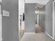 Clean and well-lit hallway with neutral paint and plush carpet at 703 Chapel Hill W Dr, Indianapolis, IN 46214