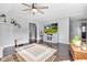 Comfortable living room features hardwood floors, neutral paint, and a ceiling fan at 703 Chapel Hill W Dr, Indianapolis, IN 46214