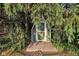This shed is hidden by mature foliage and appears to be well maintained and in good condition at 703 Chapel Hill W Dr, Indianapolis, IN 46214