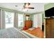 Bedroom with a ceiling fan, natural light, and hardwood floors, perfect for creating a personalized space at 7600 S Oak Dr, Indianapolis, IN 46227