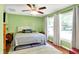 Inviting bedroom with natural light, a ceiling fan, and stylish decor, creating a relaxing and comfortable space at 7600 S Oak Dr, Indianapolis, IN 46227