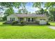 Charming single-story home with a well-manicured lawn and inviting curb appeal, perfect for suburban living at 7600 S Oak Dr, Indianapolis, IN 46227