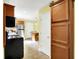 The kitchen view showcases wooden cabinetry, stainless steel appliances, breakfast bar and eat-in nook at 7600 S Oak Dr, Indianapolis, IN 46227