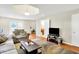 Spacious living room features hardwood floors, neutral walls, and access to bathroom at 7600 S Oak Dr, Indianapolis, IN 46227