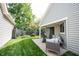 A well maintained backyard, complimented with a patio and modern outdoor seating area at 7686 Micawber Ct, Indianapolis, IN 46256
