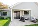 A well maintained backyard featuring a cozy covered patio and modern outdoor seating area at 7686 Micawber Ct, Indianapolis, IN 46256