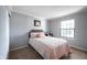 Comfortable bedroom featuring a large window and neutral decor at 7686 Micawber Ct, Indianapolis, IN 46256