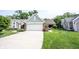Charming single-story home featuring a manicured lawn, brick accents, and a convenient two-car garage at 7686 Micawber Ct, Indianapolis, IN 46256