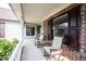 Charming front porch featuring comfortable rocking chairs and a brick facade for relaxing afternoons at 7686 Micawber Ct, Indianapolis, IN 46256