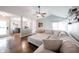 Expansive living room with a vaulted ceiling, neutral-toned sectional sofa, and open layout flowing into the dining area at 7686 Micawber Ct, Indianapolis, IN 46256
