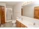 Bathroom featuring a double vanity sink, shower, and neutral-toned tile floor at 7687 Sea Crest N Way, Noblesville, IN 46062