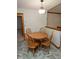 Cozy dining area with tile flooring and a modern light fixture at 7687 Sea Crest N Way, Noblesville, IN 46062
