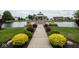 A gazebo near a tranquil pond, surrounded by landscaping, providing a serene retreat at 7687 Sea Crest N Way, Noblesville, IN 46062