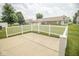 Back patio featuring concrete pavers and a white picket fence with community views at 7687 Sea Crest N Way, Noblesville, IN 46062