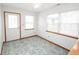 Sunlit room with tile flooring and windows, with an exterior door at 7687 Sea Crest N Way, Noblesville, IN 46062