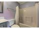This bathroom features a toilet and a shower and tub combination with a shower curtain at 7918 Bitternut Dr, Indianapolis, IN 46236