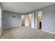 Bedroom features carpet flooring, neutral walls, and doors to the closet and bathroom at 7918 Bitternut Dr, Indianapolis, IN 46236
