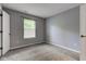 Bedroom featuring neutral walls, carpet flooring, and a window for natural light at 7918 Bitternut Dr, Indianapolis, IN 46236