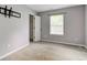 Bedroom features neutral walls, carpet flooring, and a closet at 7918 Bitternut Dr, Indianapolis, IN 46236
