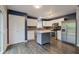 Updated kitchen boasts stainless steel appliances, granite countertops, and eat-in island at 7918 Bitternut Dr, Indianapolis, IN 46236