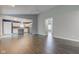 Open-concept living room showcases hardwood floors and neutral paint, leading into an eat-in kitchen at 7918 Bitternut Dr, Indianapolis, IN 46236