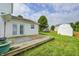 Spacious backyard featuring a wooden deck, shed, and view of the home's exterior at 852 Yellowwood Dr, Greenwood, IN 46143