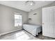 Bright bedroom featuring a twin bed, grey walls, and a window with natural light at 852 Yellowwood Dr, Greenwood, IN 46143