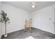 Neutrally decorated bedroom with a rocking chair, ceiling fan, and a closet at 852 Yellowwood Dr, Greenwood, IN 46143