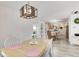 Dining room with a view to the kitchen and seating for six people at 852 Yellowwood Dr, Greenwood, IN 46143