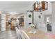 Open concept dining room with view to the kitchen and front entryway at 852 Yellowwood Dr, Greenwood, IN 46143