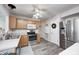 Well-lit kitchen with wood cabinets, stainless steel appliances, and modern countertops provides a functional and stylish cooking space at 852 Yellowwood Dr, Greenwood, IN 46143