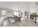 Comfortable living room with a fireplace, ceiling fan, and lots of natural light at 852 Yellowwood Dr, Greenwood, IN 46143