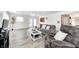 Well-lit living room with hardwood floors, backyard access, and comfortable seating offers a cozy and inviting atmosphere at 852 Yellowwood Dr, Greenwood, IN 46143