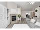 Cozy living room with fireplace and view to the dining room and entryway at 852 Yellowwood Dr, Greenwood, IN 46143