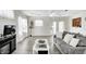 Bright living room with hardwood floors, contemporary decor, and backyard access provides a stylish and inviting space at 852 Yellowwood Dr, Greenwood, IN 46143