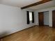 Cozy bedroom featuring laminate flooring, natural light, and closet space at 8609 Stonewall Dr, Indianapolis, IN 46231