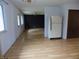 Spacious living area featuring wood floors, neutral walls, and natural light at 8609 Stonewall Dr, Indianapolis, IN 46231