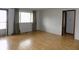 Bright living room with laminate flooring and a large window, perfect for natural light at 8609 Stonewall Dr, Indianapolis, IN 46231