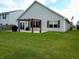 This backyard features a patio area with a pergola, providing a comfortable outdoor space at 878 Sommersweet Run, Greenwood, IN 46143